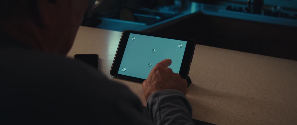 Finger swiping across a tablet screen