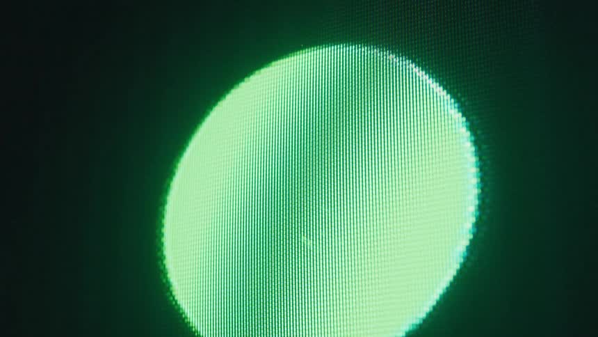 Close up of a screen with a blinking green circle