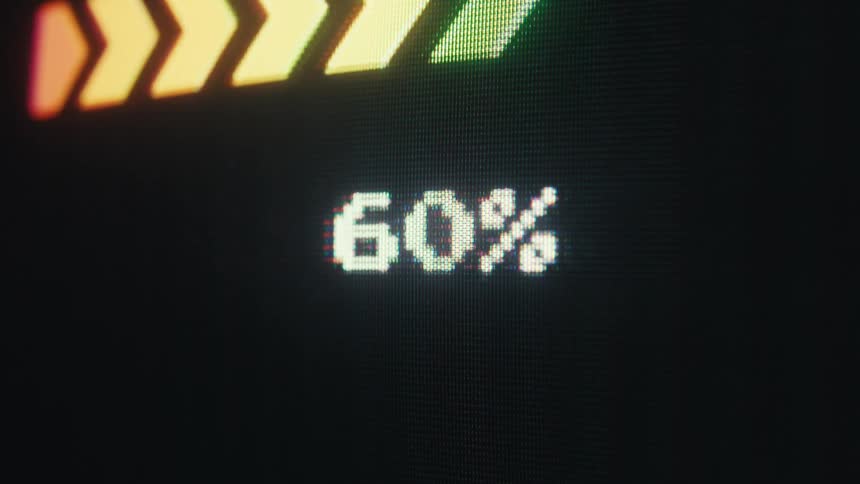 Closeup of a screen showing a percentage increasing to 100 percent