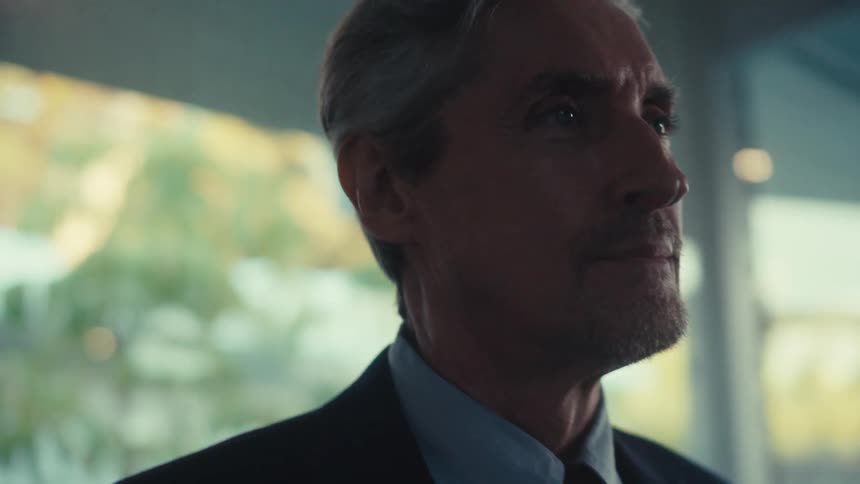 Portrait of a man in an indoor space in a suit