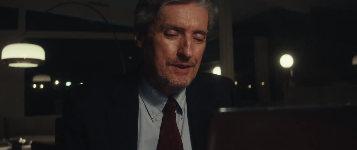 Man sitting in front of a laptop having a conversation