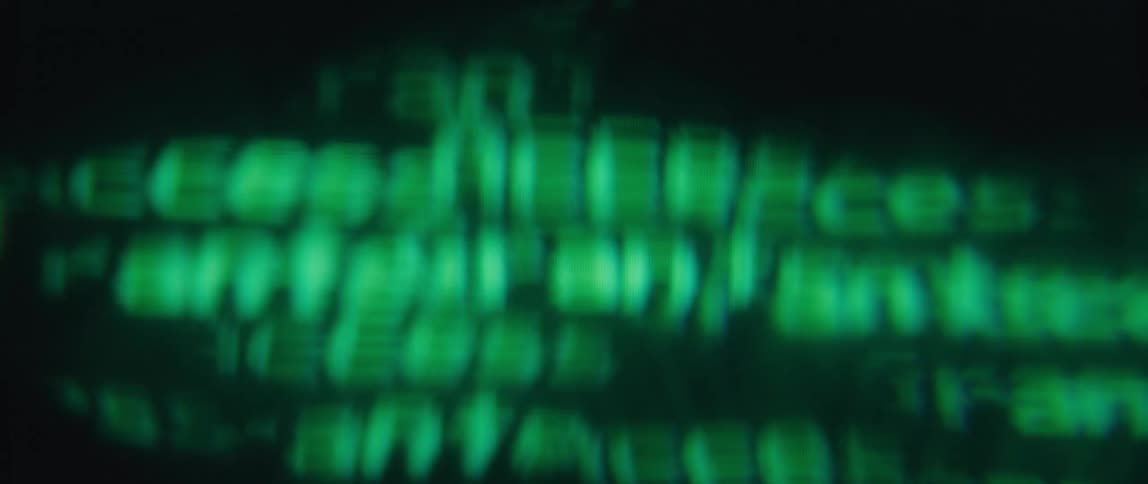 Close up of a screen with abstract green letters