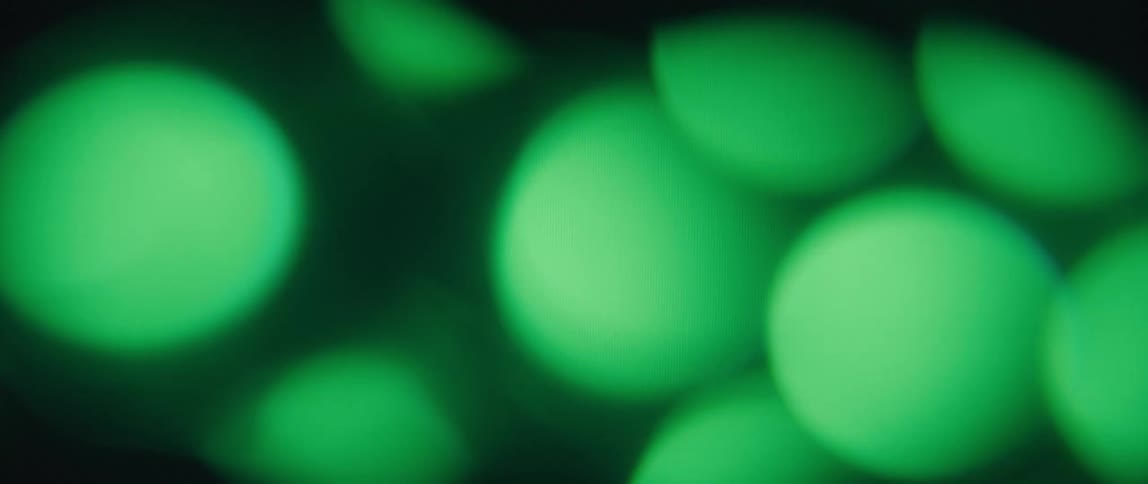 Green circle on a screen with another abstract circles