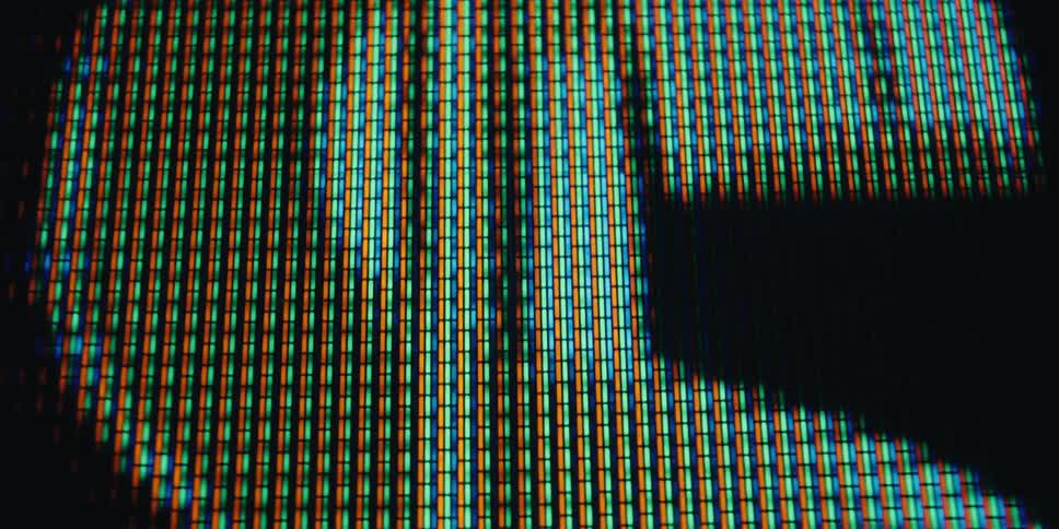 Close up of a screen displaying an abstract golden dollar sign