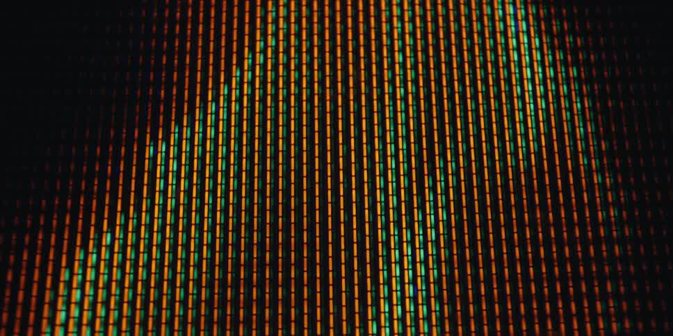 A screensaver of a flickering flame is on the display