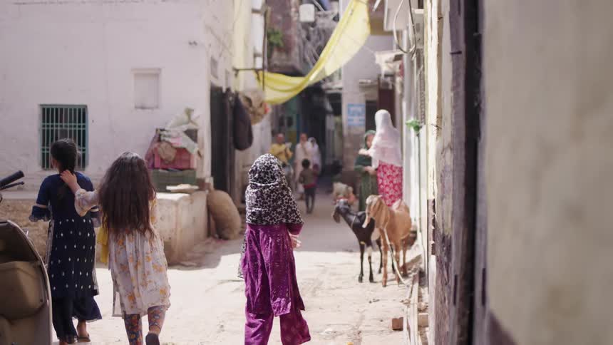 Children walk down the alley together