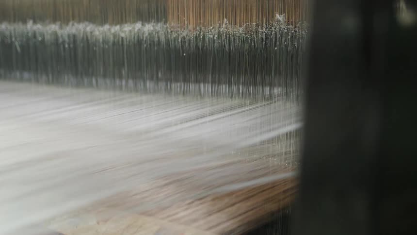 Close up of a textile machine in operation