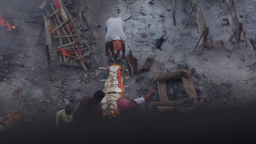 Group of people carrying wrapped food with bonfires around
