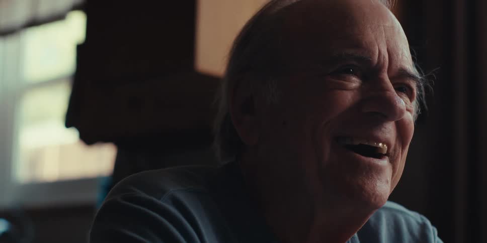 A clip of an elderly man laughing