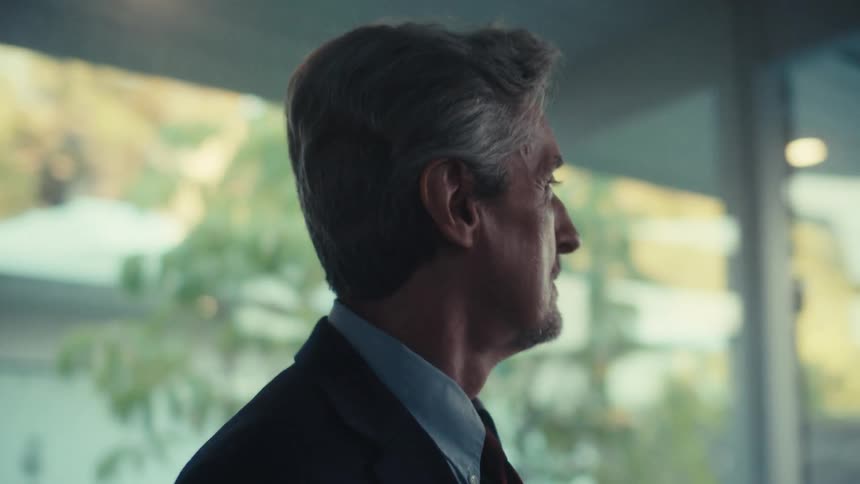 Man in suit and tie in an indoor space