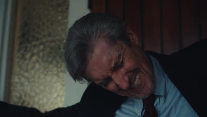 Man opening the door and walking in in a happy and vibrant manner