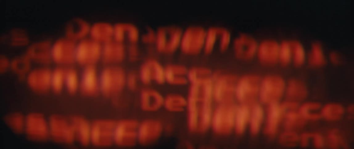 Various red texts with liquid texture moving on a black background