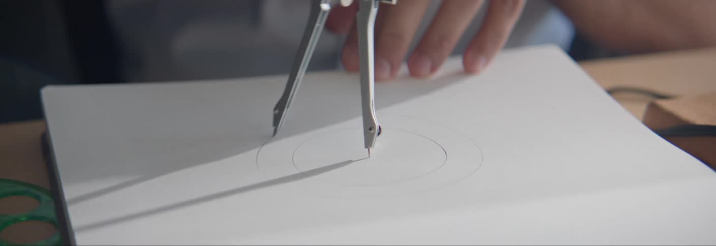 Drawing circles with a protractor on a white of paper