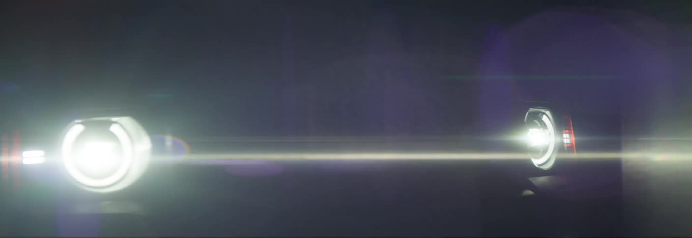 Front view of a vehicles headlights on