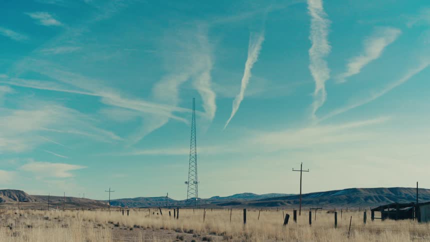 Vast landscape with transmission towers