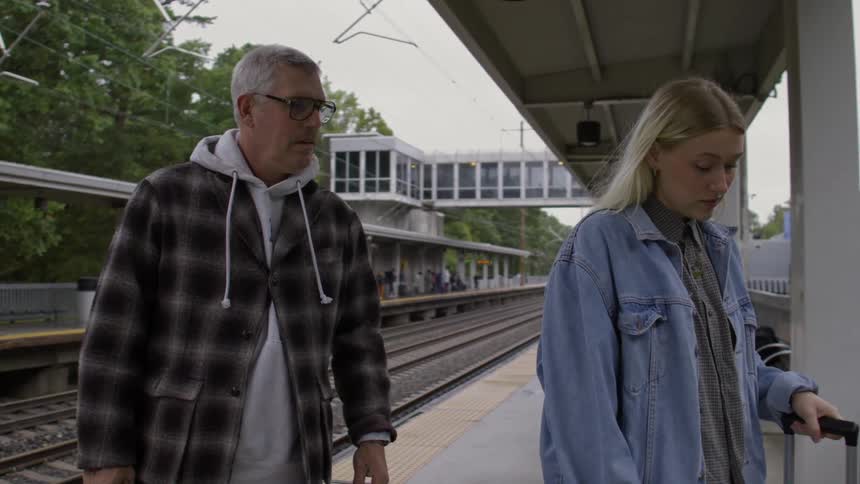 Father and daughter walking together in a subway station alvar o livre