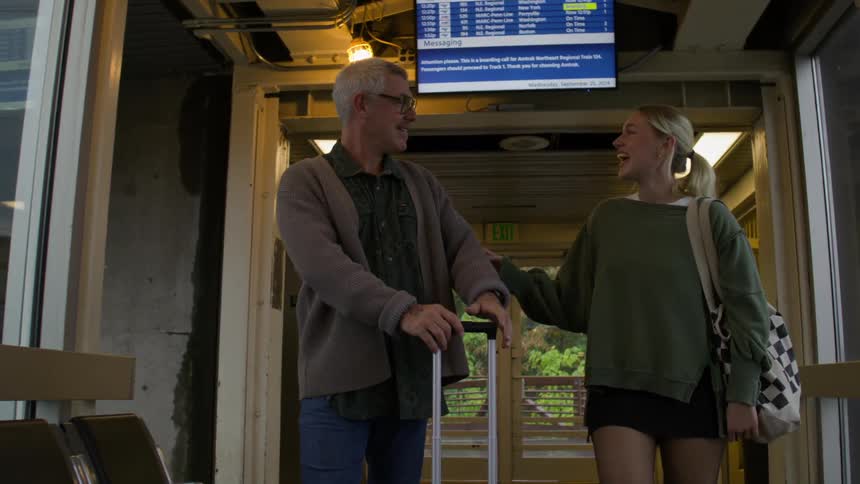 A father helps his daughter with her luggage at the airport