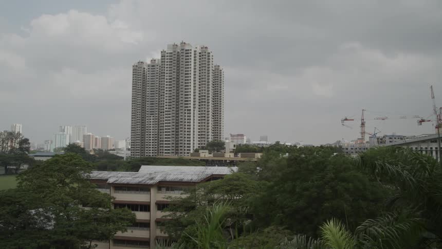 A building towers over the city landscape