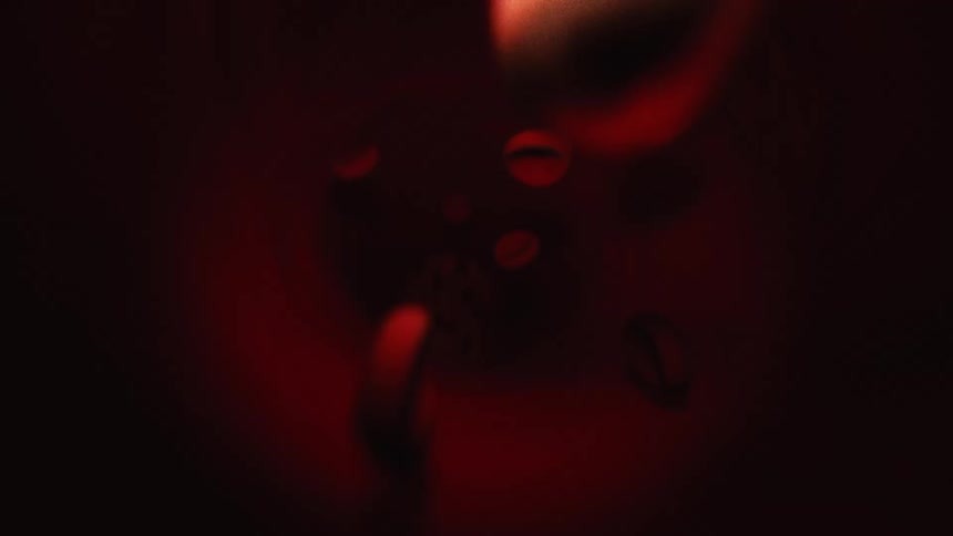 Red blood cells moving through a blood vessel