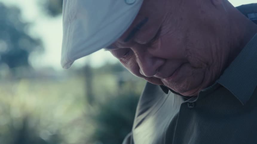Portrait of an elderly man outdoors during the day