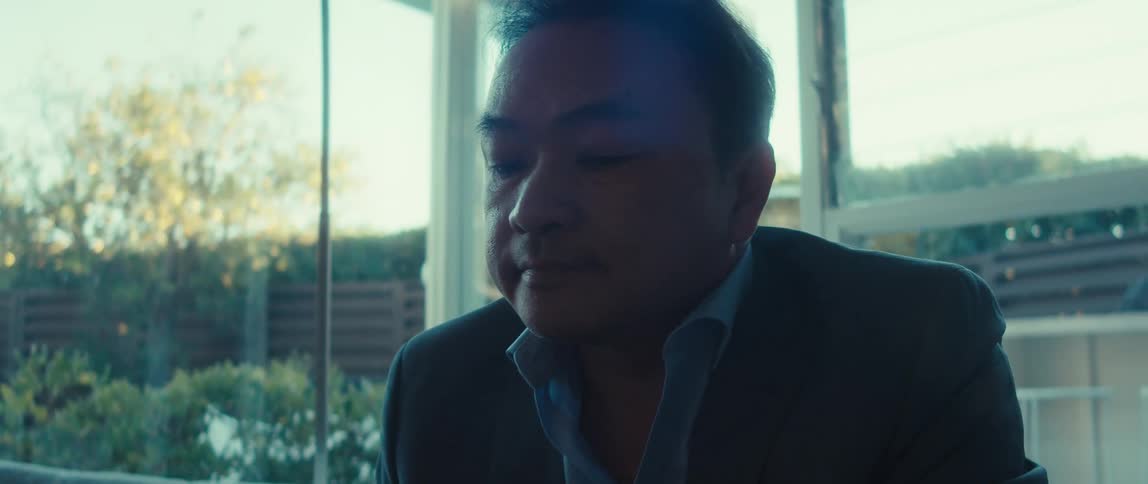 Portrait of a man in a blazer sitting