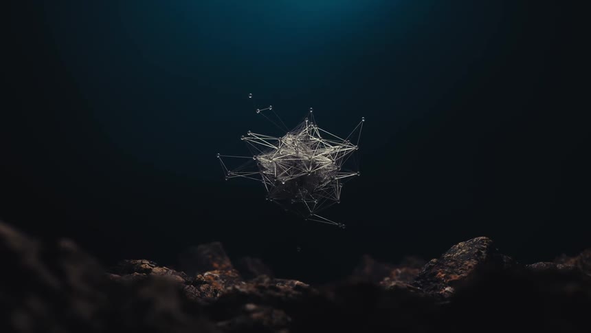 A complex geometric structure composed of interconnected lines and nodes floats in a dark underwater environment above a rocky seabed