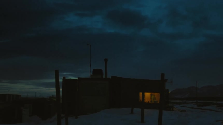 House in a natural environment with snow and mountains in the background