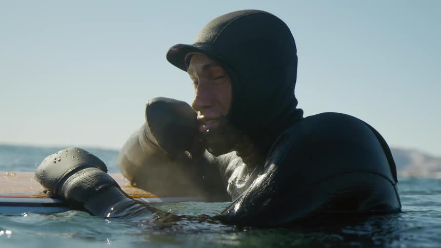 Portrait of a man in a swimming suit in the ocean