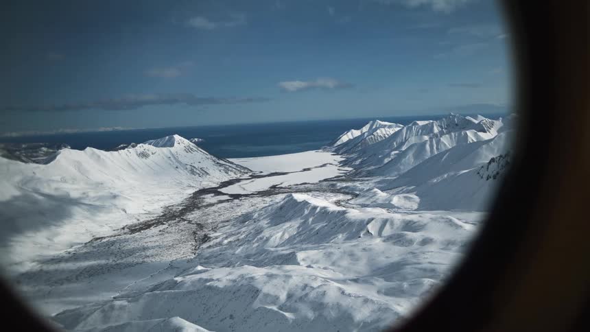 An arctic landscape as seen through a porthole