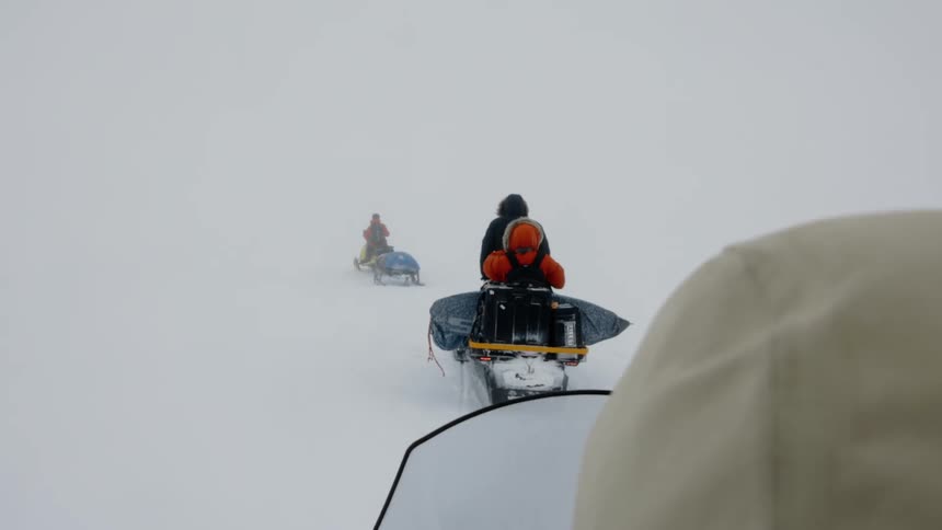 A clip of a people riding in the snow