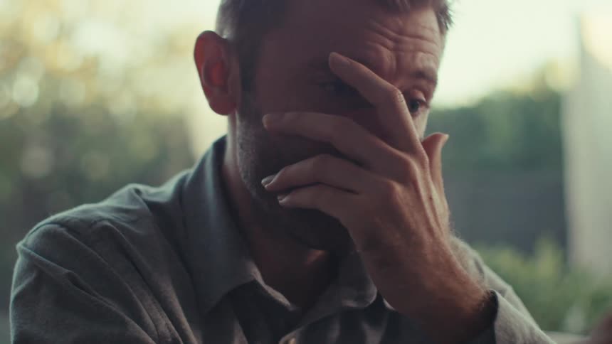 The man using the tablet received surprising news and was visibly amazed