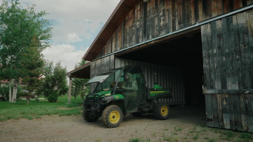 Person driving a John Deere quad