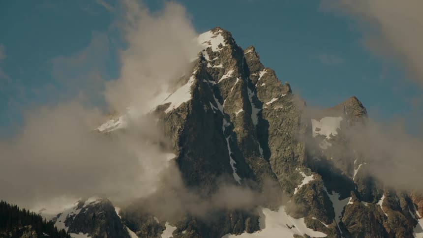 Mist around a snowy mountain
