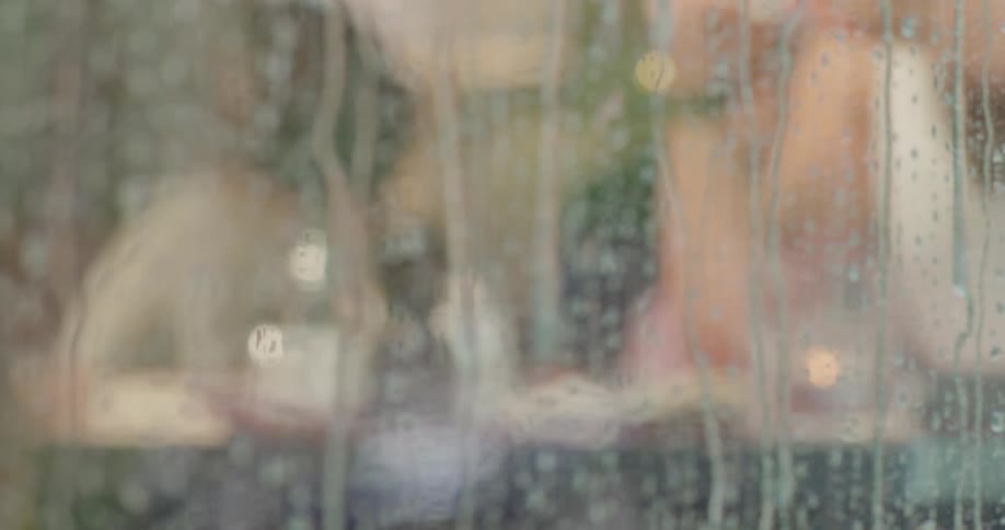 Rain running down a glass window