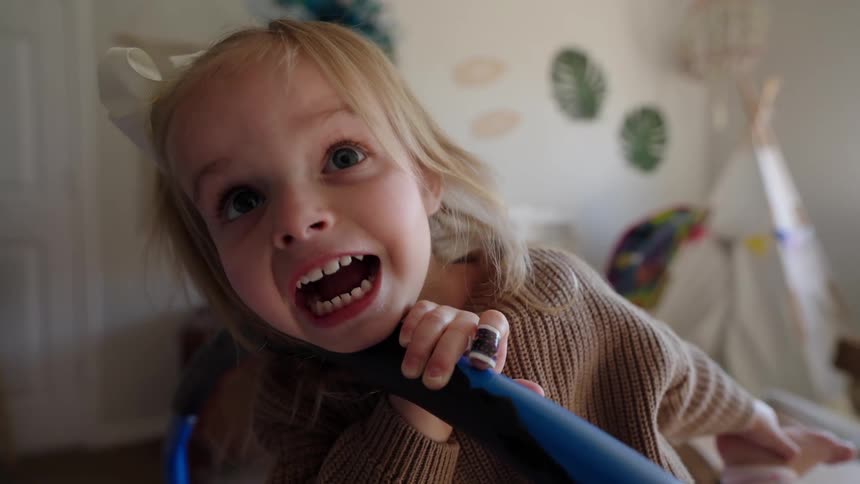 Close up of a girl having fun in her bedroom