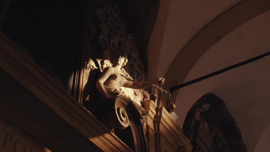 Angel holding a scale of justice in a classical architecture