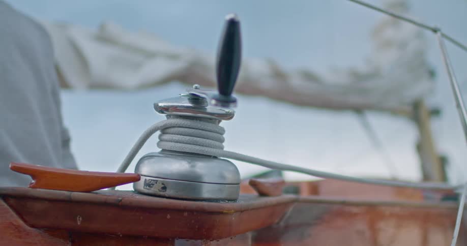 White rope on a metal support holding a boat