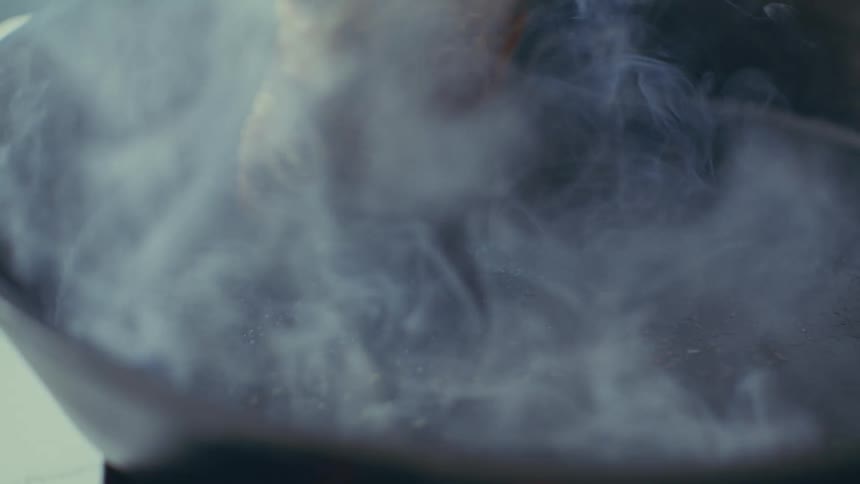 A footage of a person frying beef