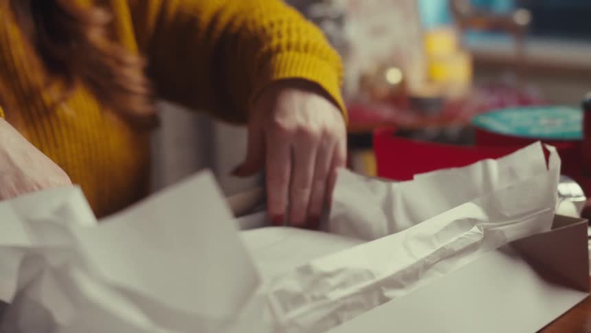 A clip of a person packaging a box