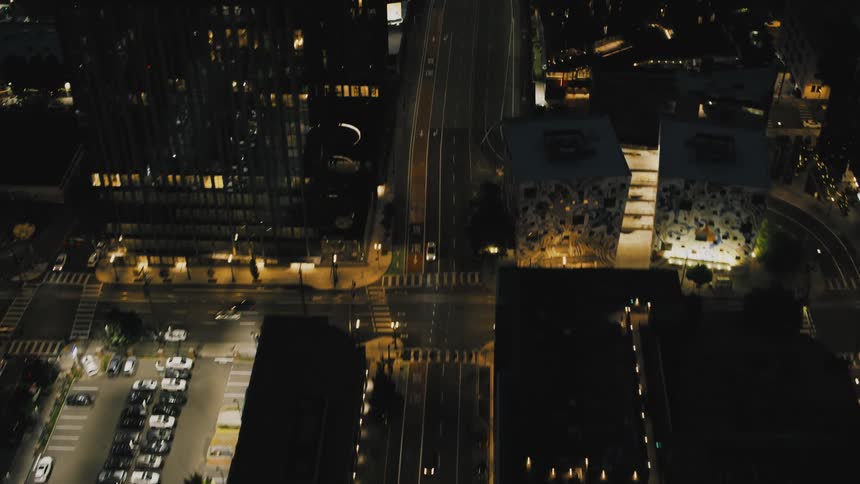 Aerial panorama of a metropolis with illuminated highways at night