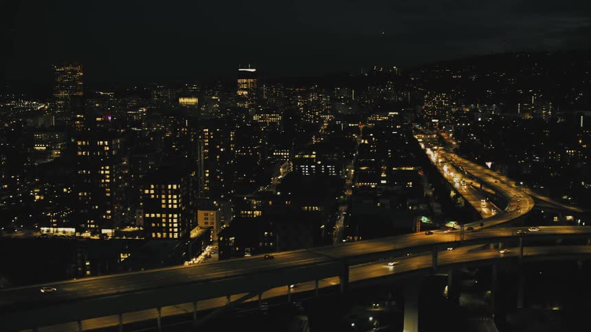 Long bridge and viaduct in a metropolis illuminated at night
