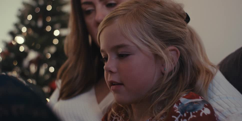 Mother reading a book with her daughter