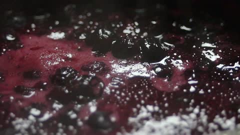 Berries and fluid boil in a pot