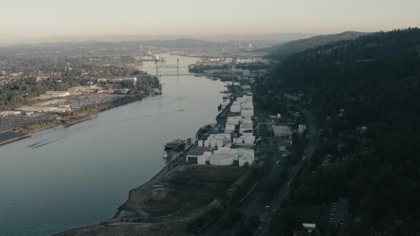 Aerial view of a sea canal and a power plant on the shore