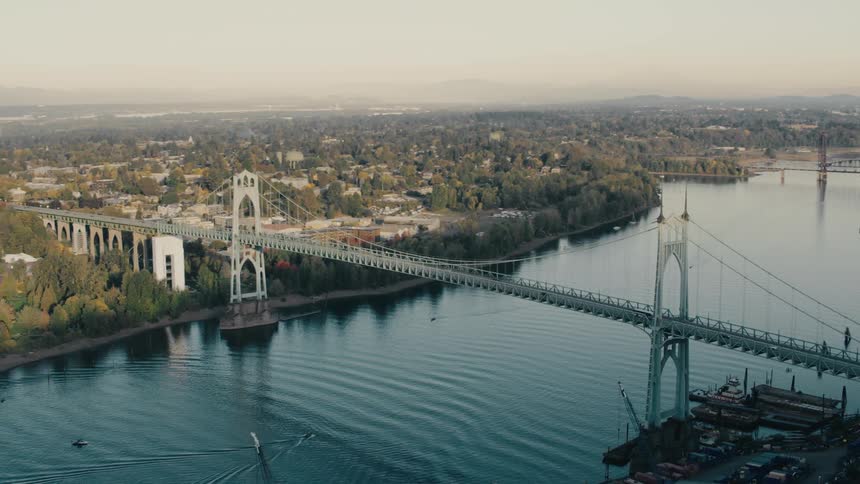 The iconic st johns bridge spans the willamette river connecting the east and west sides of portland oregon