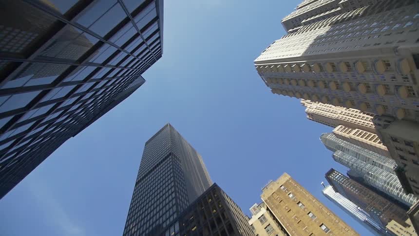 View looking up at large buildings downtown in a city