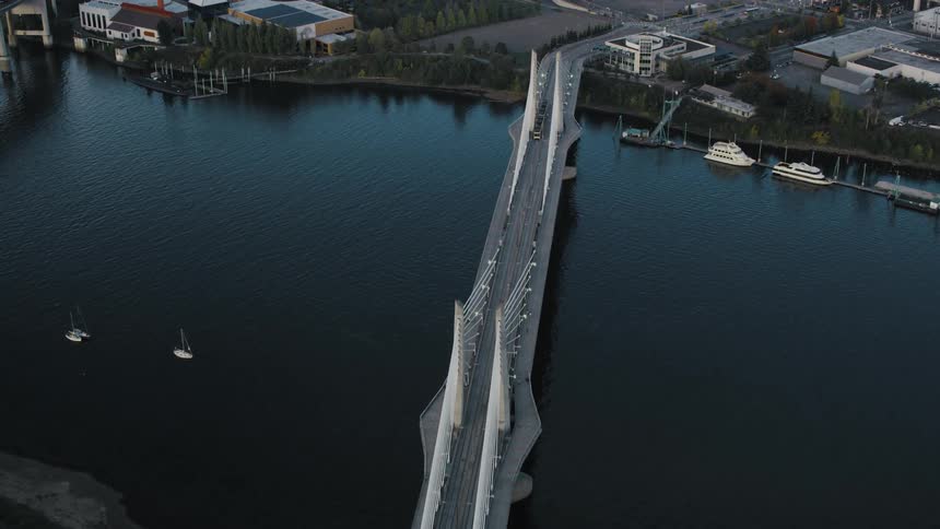 Aerial view of a bridge above a sea canal through the city