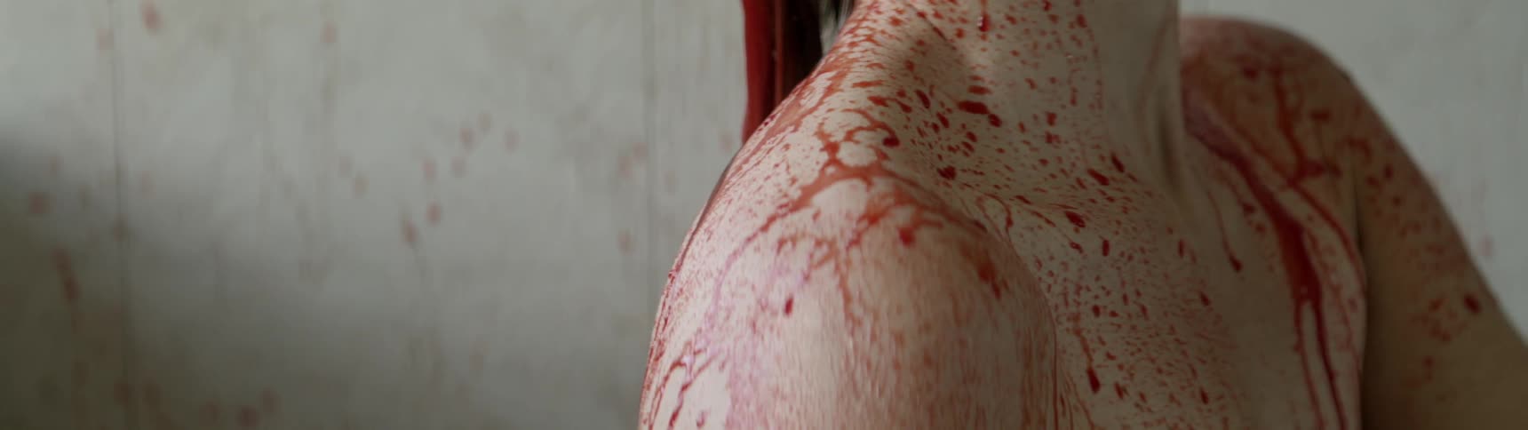 A woman showers in blood
