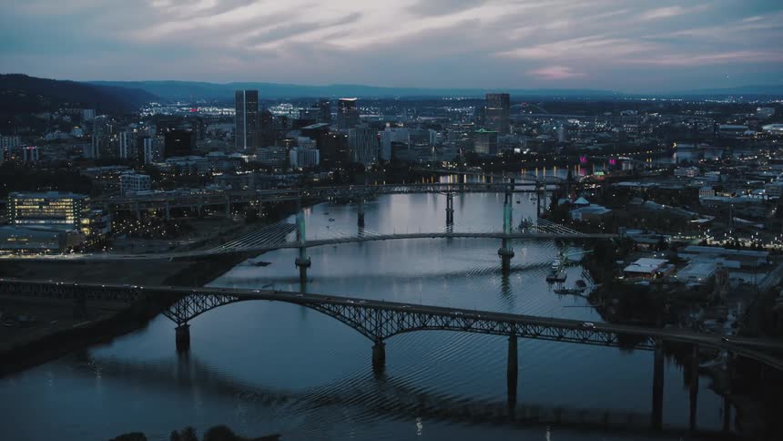 A camera pans over bridges that connect a city scene