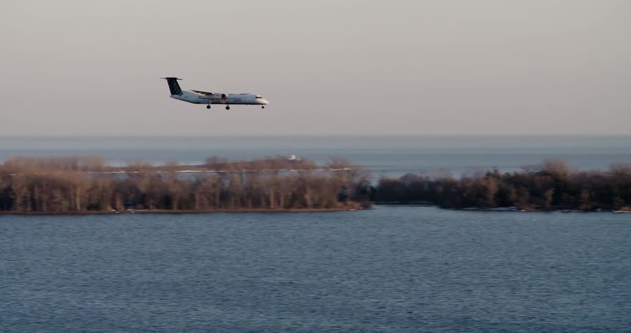 An airplane flying over the water